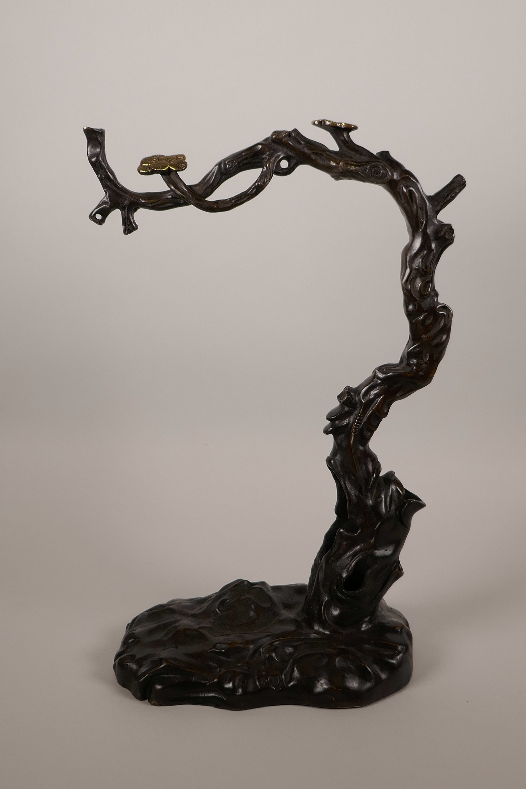 An Oriental bronze of a prunus tree with gilt blossom, 15" high