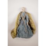 An C18th Continental pottery doll/puppet in the form of a silk robed gentleman, possibly Spanish,