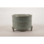 A Chinese celadon crackle glazed pottery censer on tripod supports, 4½" diameter