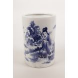 A Chinese blue and white porcelain brush pot with decoration of a woman reading a book, seal mark to