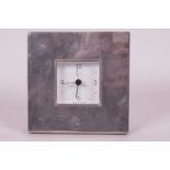 A hallmarked silver fronted desk clock 5" square