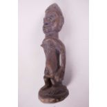 An African carved wood ceremonial figure, 10" high