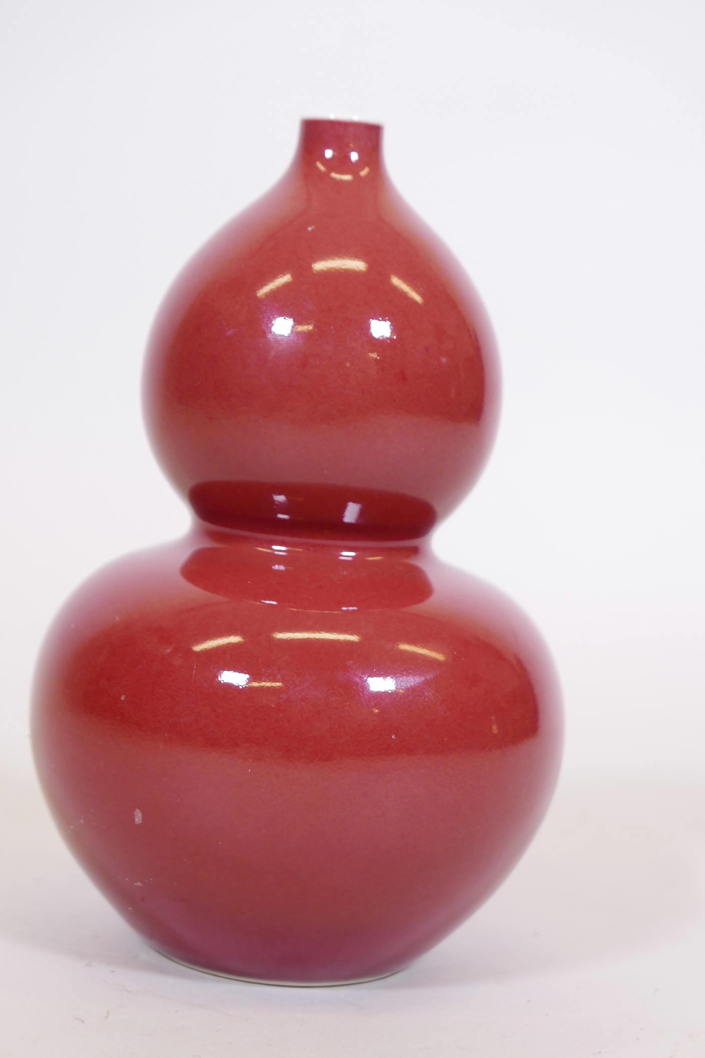 A Chinese sang de boeuf glaze double gourd vase, with blue seal mark to base, 9" high - Image 2 of 3