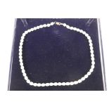 A pearl necklace with 9ct gold clasp, 17" long