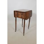A George III mahogany drop leaf table with two end drawers, raised on ring turned supports, 20" x