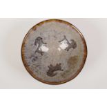 A Chinese Cizhou kiln pottery dish with goat decoration, 6½" diameter