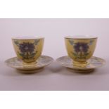 A pair of Chinese Sancai glazed porcelain cups and saucers decorated with lotus flowers, 2" diameter