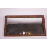 A burr walnut framed wall mirror, 23" x 12"