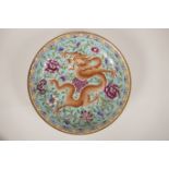 A Chinese porcelain cabinet plate with enamelled dragon decoration, 6 character mark to base, 8½"