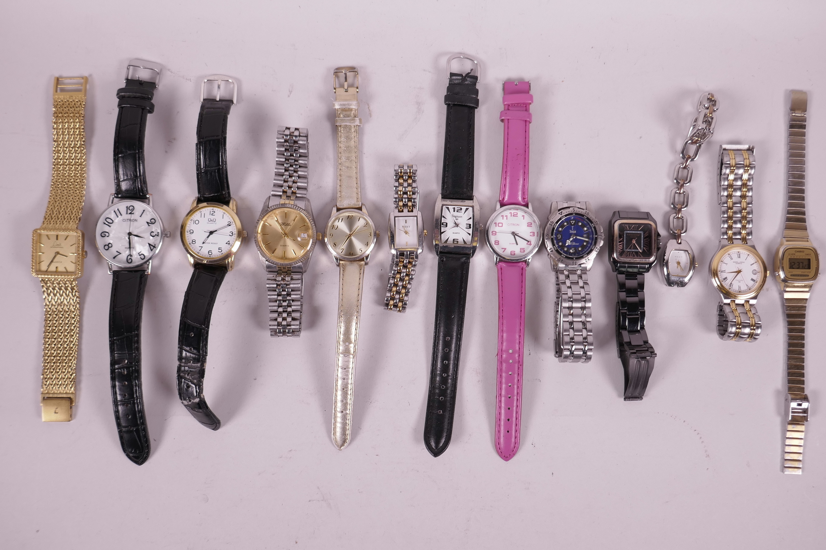 A quantity of ladies' and gentlemen's wristwatches including Casio, Limit, Citron, Terrain, Stegmann