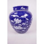 A Chinese porcelain blue and white Hawthorn pattern ginger jar and cover, 4 character mark to