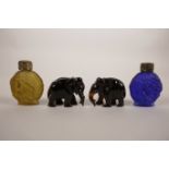 Two Continental moulded glass scent bottles, together with two faux tortoiseshell elephants, 2"