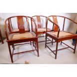 A set of four Chinese hardwood hoop back chairs with inset cane seats, one arm A/F
