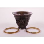 A Chinese faux horn libation cup with carved kylin decoration and four character mark to base,