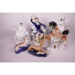 A collection of Staffordshire flat back figures, two ladies on horseback, The Hunter, two