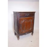 A C19th Continental oak cupboard with a single drawer, 29½" x 17", 39" high