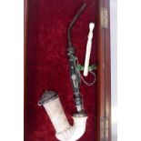 A C19th meerschaum pipe, the hardwood stem with pique work decoration, 13" long, in a bespoke