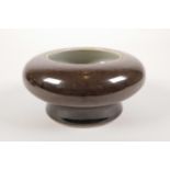A Chinese brown glazed porcelain bowl, seal mark to base, 5" diameter