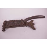 A Kenrick cast iron nutcracker with leaf decoration, 10" long