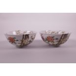 A pair of Chinese polychrome porcelain rice bowls with prunus tree decoration, seal mark to base, 5"
