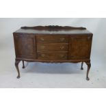 A 1920s walnut veneered walnut sideboard on carved cabriole legs, 54" x 21", 39" high