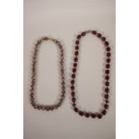 An Oriental cherry amber necklace, together with a cloisonné beaded necklace, longest 24"