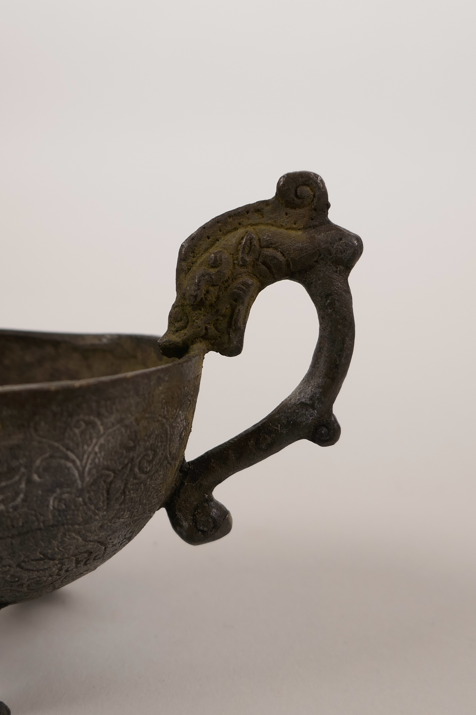 A Chinese bronze pourer on tripod supports with a dragon head handle, 5" long - Image 2 of 2