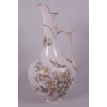 A Royal Worcester ewer painted with dog roses and flowering ivy, bee mark to base, 13" high, small