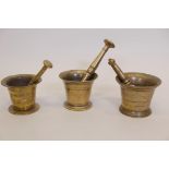 Three antique bronze pestles and mortars, largest 4" high
