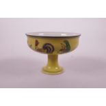 A Chinese doucai porcelain stem cup decorated with chickens and flowers on a yellow ground, 6