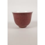 A Chinese sang de boeuf glazed porcelain tea bowl, 3½" diameter