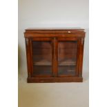 A Victorian two door walnut pier cabinet with brass mounts and inlaid frieze, 45" x 13" x 42"
