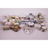 A collection of thirty Limoges and Halcyon Days porcelain and enamel pill boxes including a