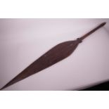 An Oceanic carved hardwood spear paddle, 42" long