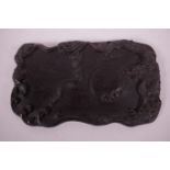 A Chinese hardwood ink palette with carved dragon decoration, 11½" x 7"