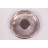 An Eastern silver dish set with an Arabic coin to centre (not marked), 3½" diameter