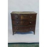 An early C19th mahogany bowfront chest of three long drawers, raised on swept supports, 37" x 21"