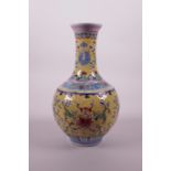 A Chinese polychrome enamelled porcelain vase with lotus flower decoration on a yellow ground,