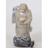 A Chinese carved soapstone figure of lohan, 9" high