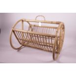 A Franco Albini style cane magazine rack, 17½" long