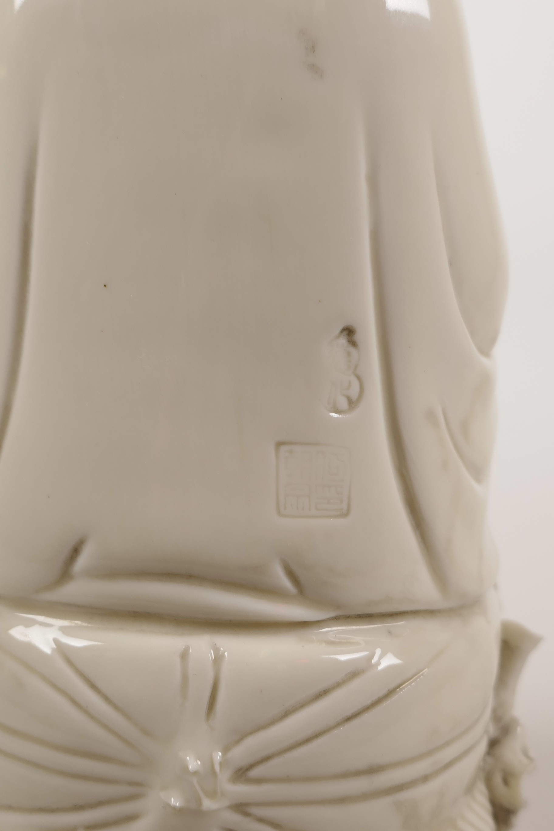 A Chinese blanc de chine porcelain figure of Quan Yin seated on a lotus throne, impressed marks - Image 3 of 3