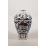 A small Chinese blue and white pottery meiping vase with carp decoration highlighted in red, 6" high