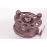 An early C20th Bakelite fishing reel, 'The Modernite Pixie', 4" diameter