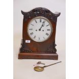 A C19th bracket clock, with carved figured mahogany case, the enamel dial with Roman numerals and