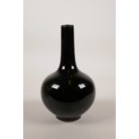 A Chinese black mirror glaze porcelain bottle vase, mark to base, 6½" high