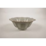 A Chinese Song style celadon glazed petal shaped porcelain rice bowl, 6" diameter
