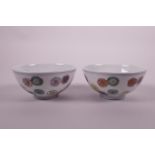 A pair of Chinese doucai porcelain rice bowls with floral decoration, 6 character mark to base,