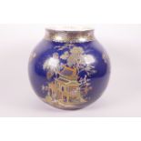A lustreware porcelain vase by Carlton Ware decorated with Chinoiserie scenes on a deep blue ground,