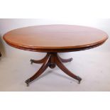 A C19th mahogany tilt top breakfast table, raised on a carved column and four splay supports with