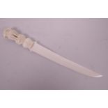 A late C19th/early C20th ivory letter opener, with carved handle in the form of three lions, 12"